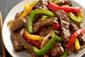 Chinese Pepper Steak served with vibrant peppers and glossy sauce