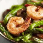 stir-fried shrimp, asparagus, and mushrooms on plate