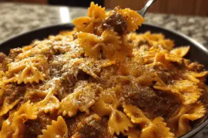 Creamy Velveeta bowtie pasta with Italian beef marinara in a bowl