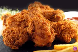 Family enjoying homemade KFC chicken at kitchen table