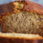 Freshly baked banana bread on a rustic kitchen table