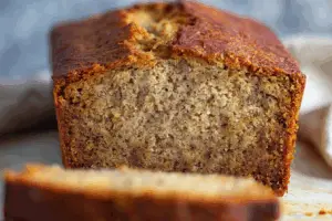 Freshly baked banana bread on a rustic kitchen table