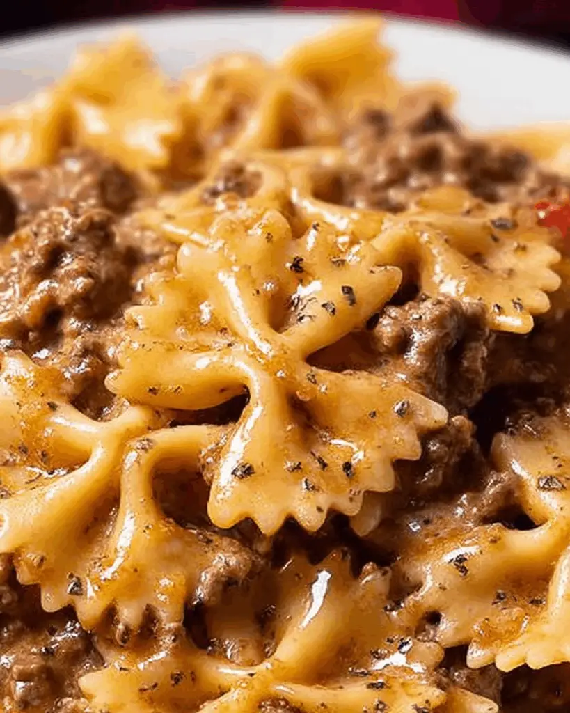 Velveeta cheese melting into Italian beef marinara sauce