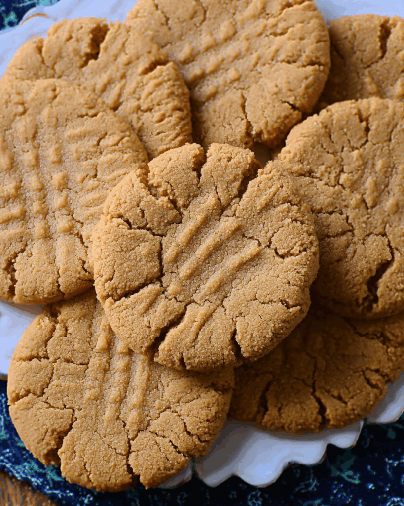 Rolling peanut butter cookie dough in sugar