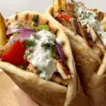 Greek Chicken Gyros freshly made with marinated chicken and tzatziki