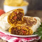Grilled cheese burrito recipe with melted Colby Jack cheese, beef, and rice