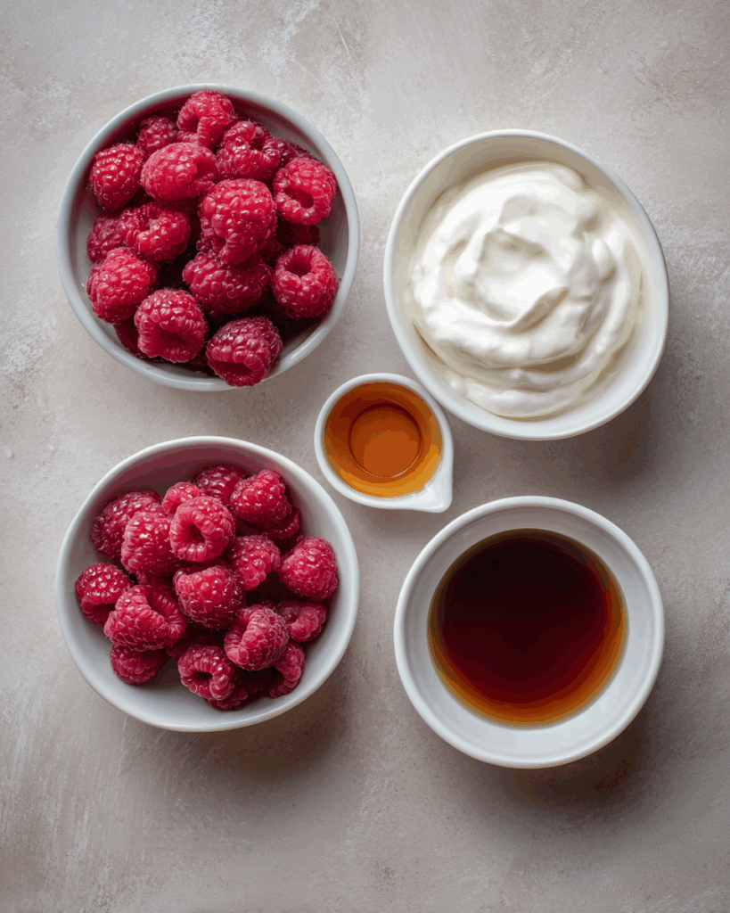 Mixing raspberries with yogurt for frozen yogurt bites