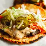 Smash Burger Tacos recipe served fresh with melty cheese, lettuce, and pickles