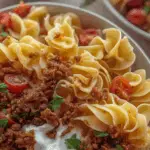 Close-up of Turkish pasta recipe with beef, yogurt sauce, and Turkish butter