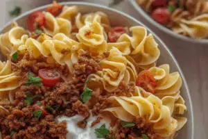 Close-up of Turkish pasta recipe with beef, yogurt sauce, and Turkish butter